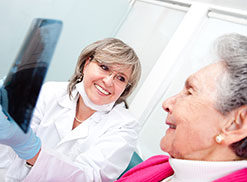 Woman at a dentist appointment paid for by medicare