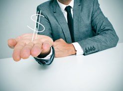 Man with an outstretched hand with a dollar sign